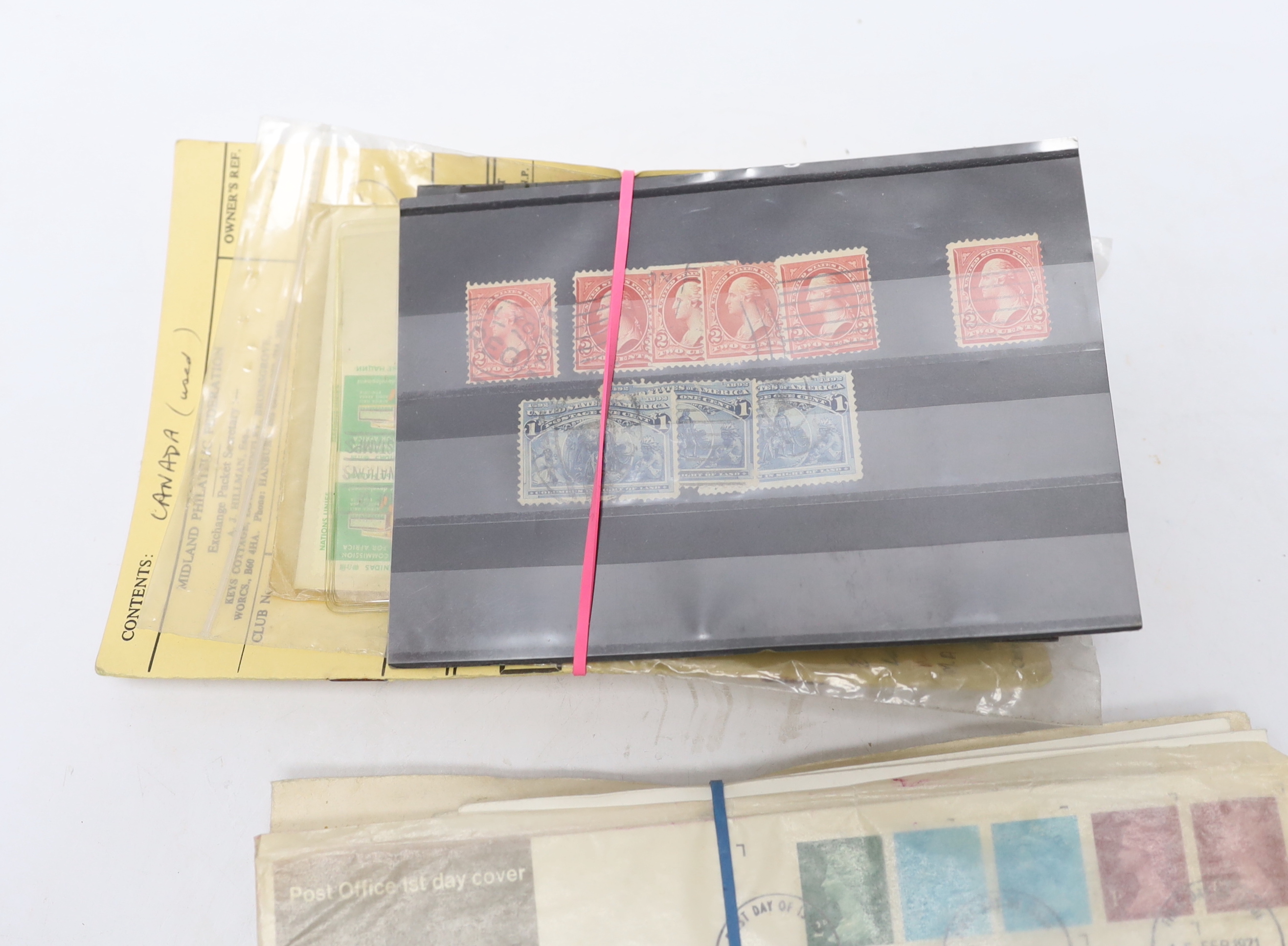 A collection of postage stamps and First Day covers